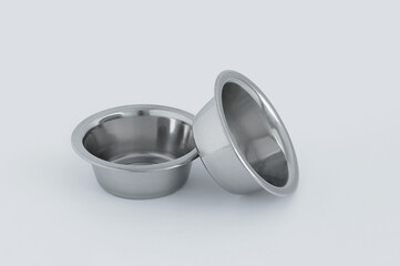 Two metal bowls on  white background.