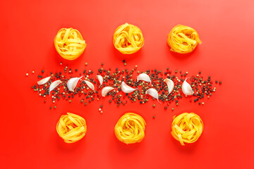 Flat lay photo of Ingredients for italian pasta on red background.