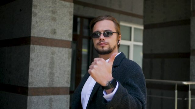 Confident successful man counting to three with fingers in slow-motion. Satisfied wealthy person listing three things that brought him success. Businessman performs one, two, three gesture on one hand