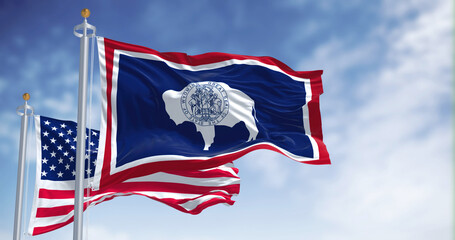 The Wyoming state flag waving along with the national flag of the United States of America