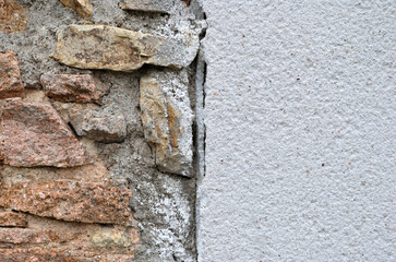 Rough Textured White Painted Wall and Stones Divided Vertically