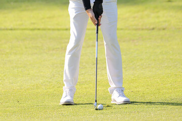 Young male golfer player on golf course
