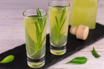 Limoncella with a sprig of rosemary.Italian lemon liqueur.
