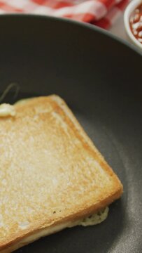 Video of freshly toasted cheese white bread sandwich prepared on frying pan