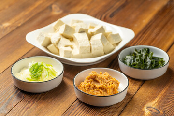 The production process of Japanese tofu and wakame miso soup