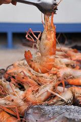 cooked shrimp on the charcoal stove.