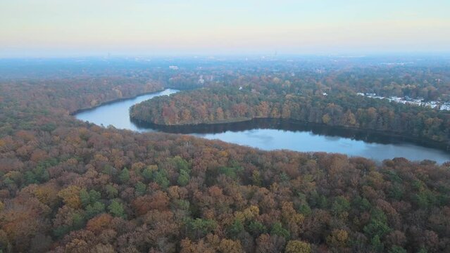 Aerial view of colorful fall trees around Krumme Lanke in Grunewald forest Berlin Germany