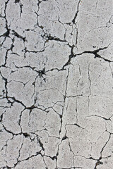 Cracked paint on tarmac