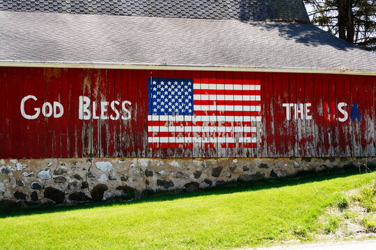 God Bless the USA on the side of a red barn