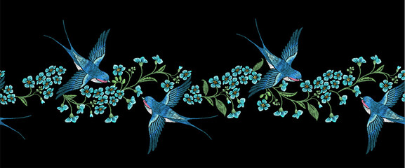 Embroidery horizontal seamless border with blue forget-me-not flowers and  swallows  on a black background - obrazy, fototapety, plakaty
