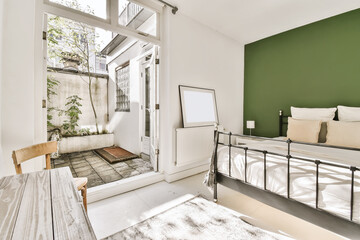 Spacious light bedroom with cozy bed and terrace