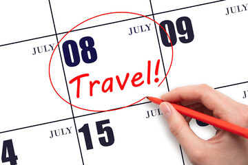 8th day ofJuly. Hand drawing a red circle and writing the text TRAVEL on the calendar date 8July....