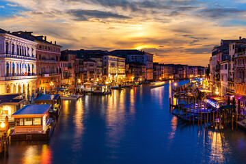 Beautiful night buildings in the Grand Canal in twilight, view from Rialto Bridge, Venice, Italy