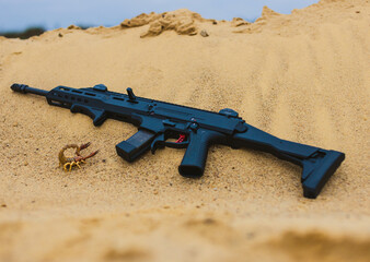 Scorpion mashine gun on sand