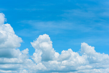 Naklejka na ściany i meble White clouds are soft and fluffy floating on blue sky for backgrounds concept, Selective focus.
