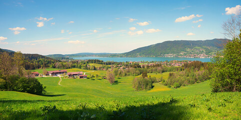 Fototapeta na wymiar idyllic tourist resort Bad Wiessee and lake Tegernsee, view from lookout place Bucherhang. spring landscape upper bavaria
