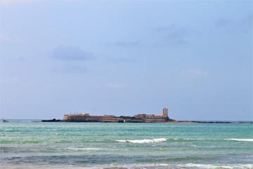 Paradise beach in spain, beach of sancti petri, castle of sancti petri