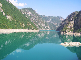 Travel to calm turquoise lake in mountains