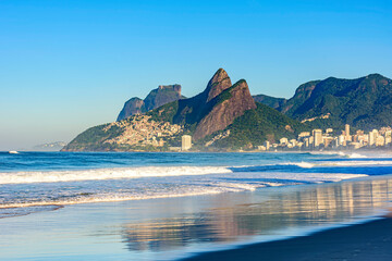 Dawn in the city of Rio de Janeiro with the empty Ipanema beach with the reflection of the...