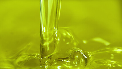 Pouring olive oil, closeup