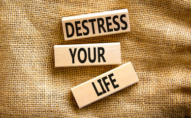Destress your life symbol. Concept words Destress your life on wooden blocks. Beautiful canvas table canvas background. Psychological business and destress your life concept. Copy space.