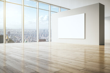 Big blank white poster on beige partition in empty spacious hall with wooden floor and city view from huge window. 3D rendering, mockup