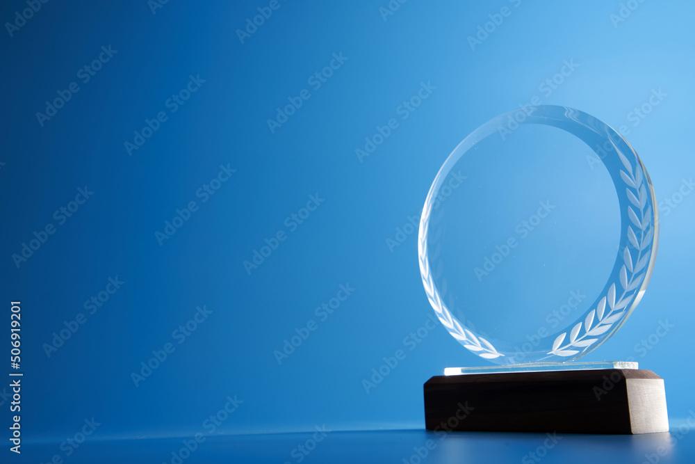 Wall mural crystal trophy against blue background