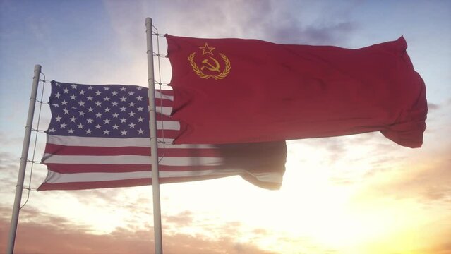 URSS Soviet Union and United States flag waving at wind at sunset. The Cold War