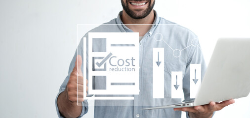 Cost reduction Concept. Businessman with his hand lowers the arrow of the graph. Cost text with a down arrow. budget, Cost Management