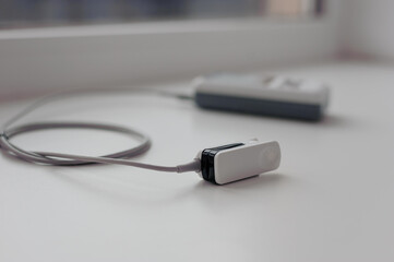 Fototapeta premium Pulse oximeter on a white background. Medical control and diagnostic device for measuring the saturation of capillary blood with oxygen