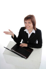 Happy woman using laptop and showing copy-space for product or advertisement text isolated on white  background