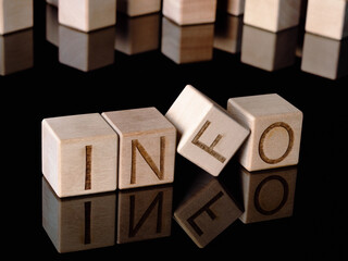 Text INFO on wooden cubes as an information acquisition concept