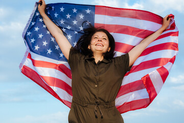 young beautiful woman holding USA flag