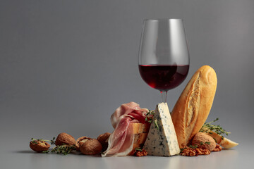 Red wine with traditional Mediterranean snacks.