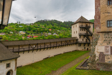 Fototapeta na wymiar Castle in Banska Stiavnica town in cloudy day after rain