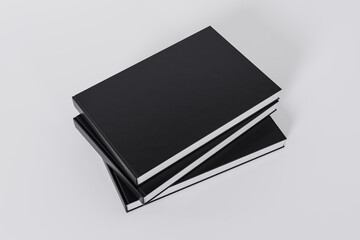 Mockup of a stack of rectangular books with a blank glossy black cover on white background. Isolated with clipping path.	

