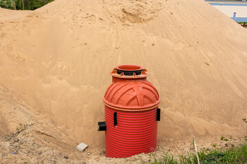 Drainage well in the sand.