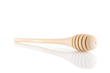 Single wooden for honey spoon on white background, honey stick isolated, Wooden spoon for honey. Close-up