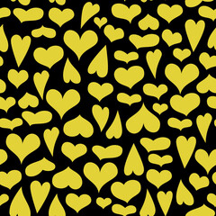 Seamless pattern of cute hearts of yellow colors on a dark background. Wallpaper for season decoration, wrapping paper, clothing prints. Vector illustration.