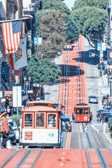 San Francisco, California, USA - October 16, 2021, the cable car ascends the popular hill of Powell Street in the vibrant downtown area of Union Square in downtown San Francisco.
