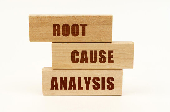 On a white surface are wooden blocks with the inscription - Root Cause Analysis