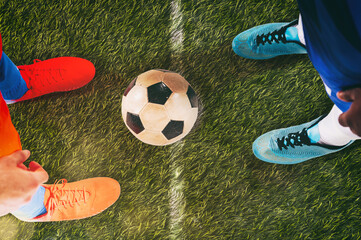 Two soccer players challenge each other at the stadium