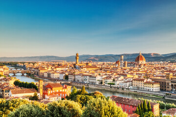 Fototapeta premium Florence Aerial View at Sunrise over Ponte Vecchio Bridge, Palazzo Vecchio and Cathedral of Santa Maria del Fiore with Duomo