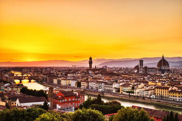 Fototapeta na wymiar Florence Aerial View at Golden Sunset over Ponte Vecchio Bridge, Palazzo Vecchio and Cathedral of Santa Maria del Fiore with Duomo