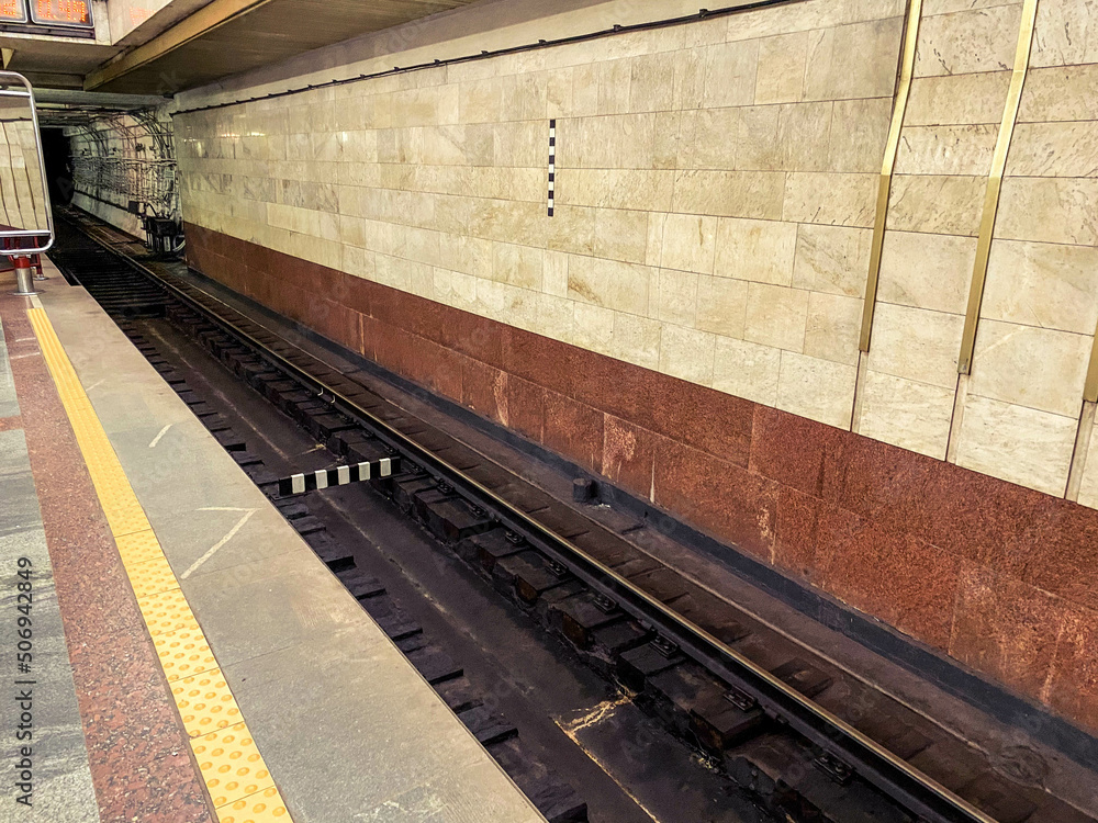 Poster tunnel in the subway for the movement of high-speed trains. rails and separators on the tracks are i
