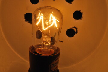 tungsten bulb on, dim light - obrazy, fototapety, plakaty