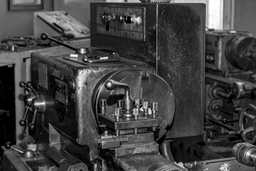  Metalworking workshop, metal processing machines.  Vintage Industrial Machinery in a old factory - black and white photo