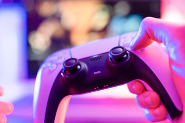 Close-up. Gamepad, joystick. Modern gadget. The concept is video games, modern digital technologies, dartless technologies, hobbies, hobbies, communications, cyberspace. © Anton