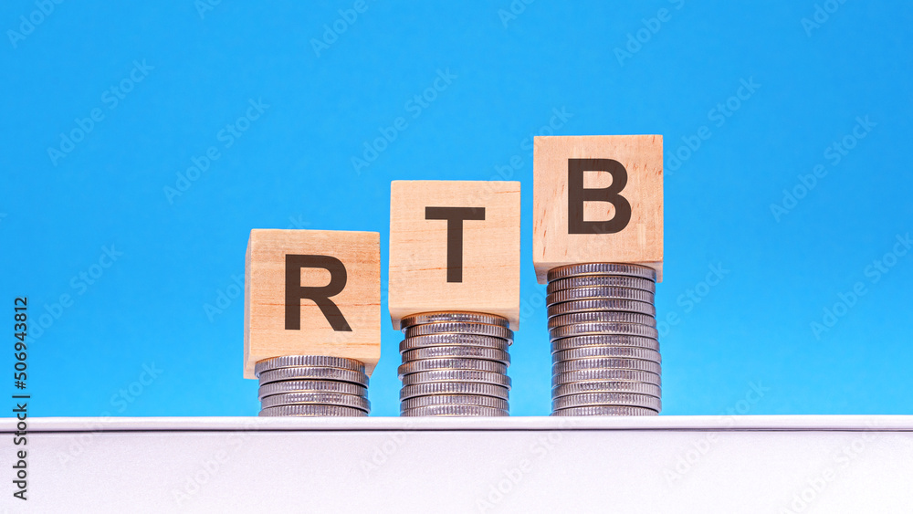 Aufkleber rtb - text on wood cube block stack with coins