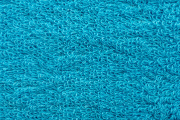 Fototapeta na wymiar The texture of the blue towel close-up. Material. Textile